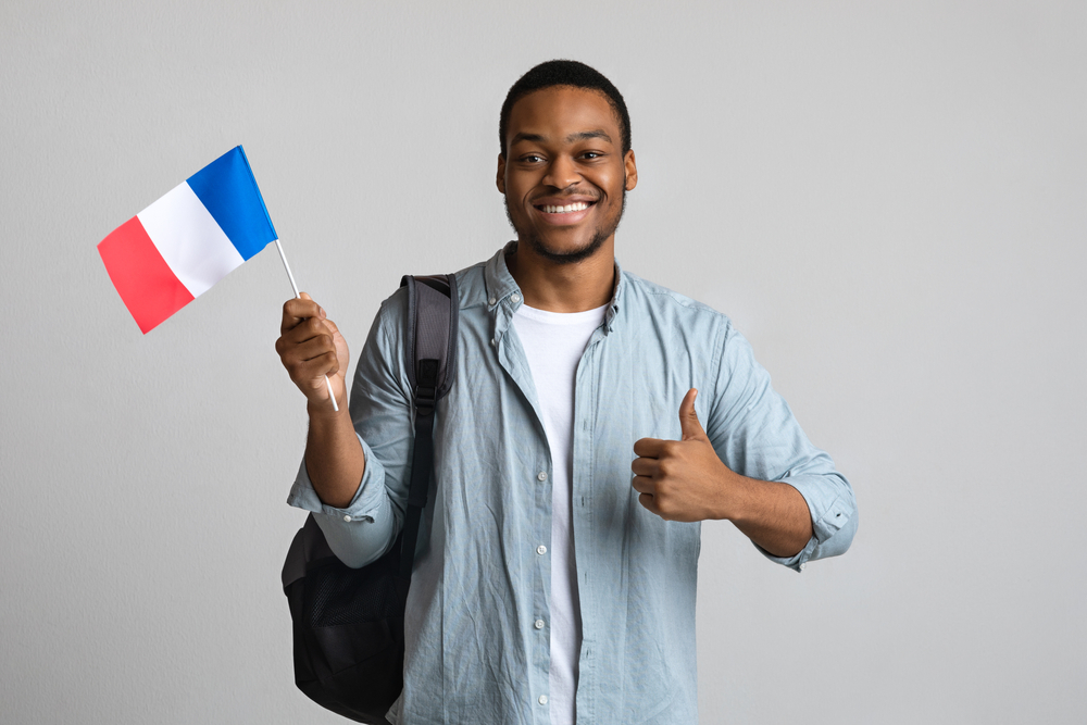 Happy,Black,Man,Showing,Thumb,Up,And,Flag,Of,France,
